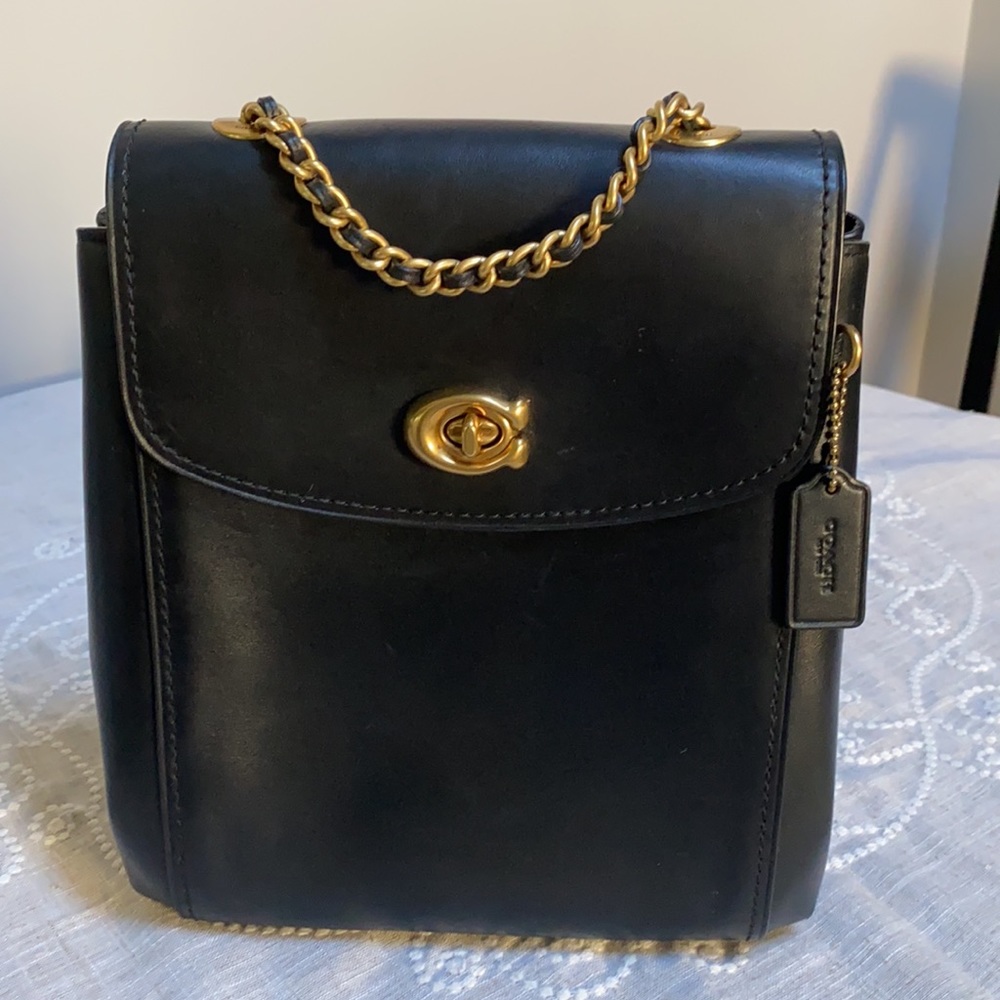 Coach black leather backpack/ cross body bag